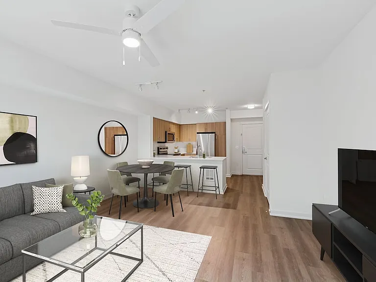 Renovated Package II living and dining area with hard surface flooring