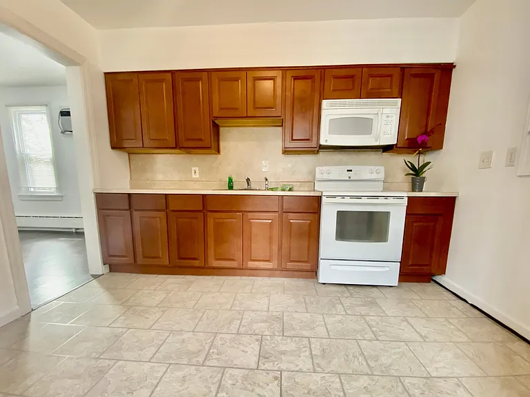 there is now a dishwasher directly to the left of the kitchen sink