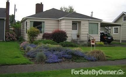 2775 Maple St.
						:
						Front of house with single garage and carport