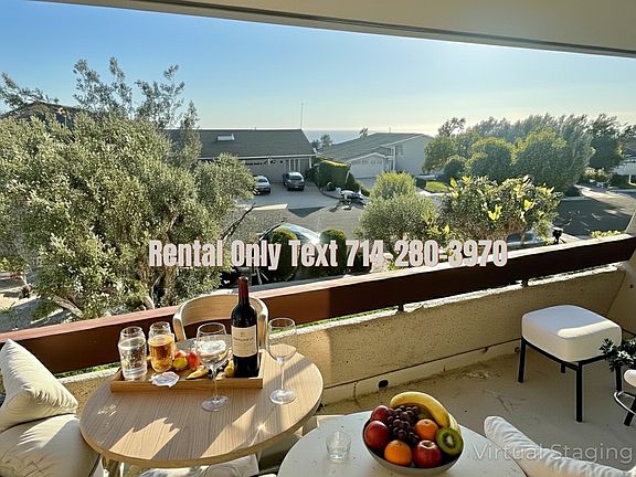 Enhanced photo of 30242 Via Borica. View towards ocean balcony off living room