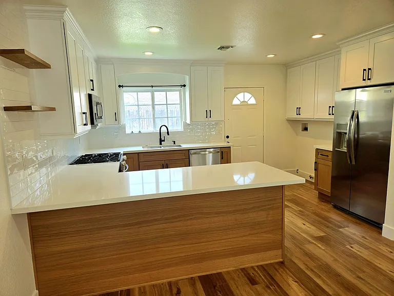 Completely remodeled kitchen with new cabinets, new countertops, new refrigerator, new stove / range, new microwave, new dishwasher, new sink, new faucet. Everything is NEW and Clean !
