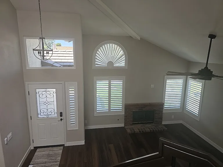 Front room/entrance. New energy-efficient windows throughout, wood shutters on the lower level for additional energy savings and luxury.