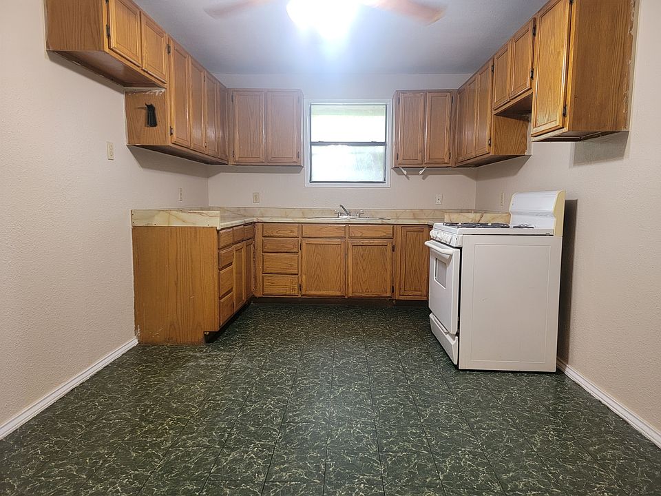 Large eat in kitchen includes stove and refrigerator