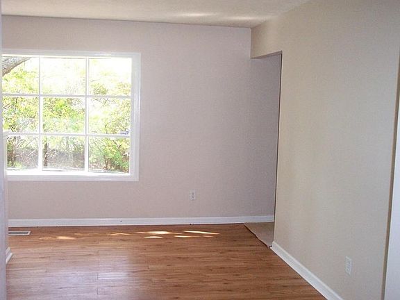 12 X 09 Dining Room with new laminate flooring and a full bay window for lots of natural light!