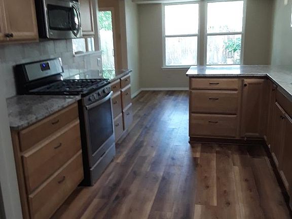 all new ,maple cabinets with drawers, self closing; granite, gas self-cleaning oven, built-in microwave
