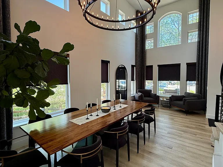 Custom Hunter Douglas shades in dining room halfway closed