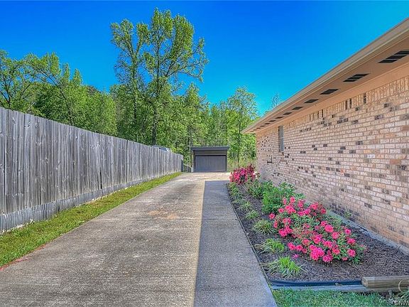 Beautifully Landscaped drive that leads to 2 car attached garage.