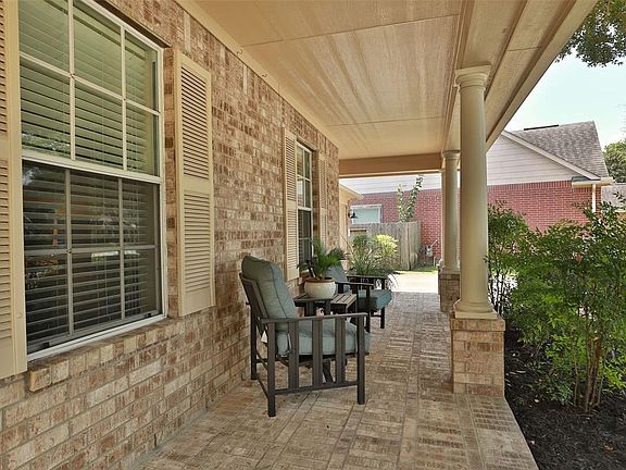 Brick is extended onto the porch area for a custom feel.