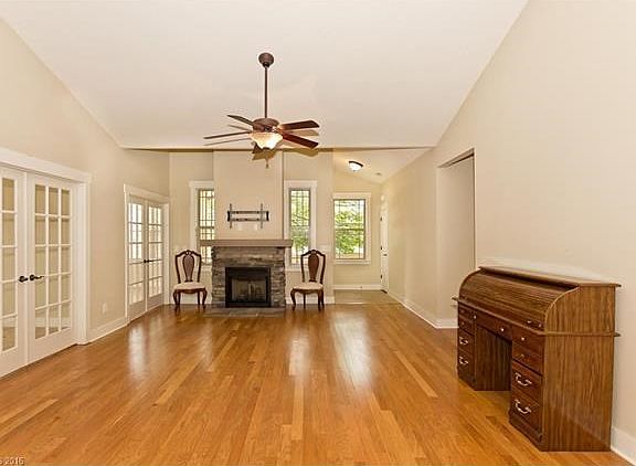 Living Room - Two sets of French Doors lead to Sunroom and office/Den