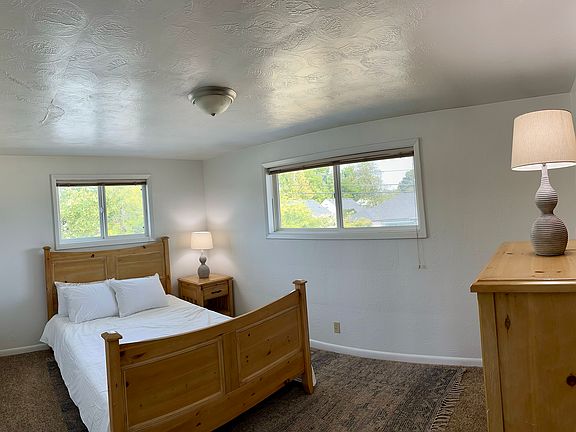 First bedroom with queen size bed and full closet.