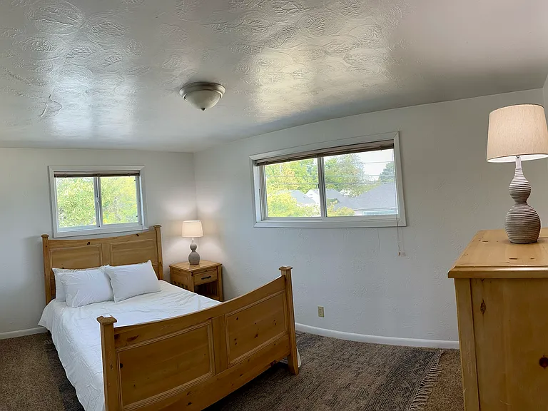 First bedroom with queen size bed and full closet.