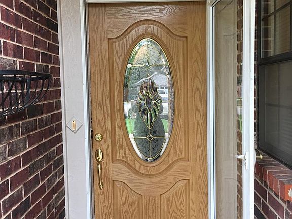Charming front door with storm door