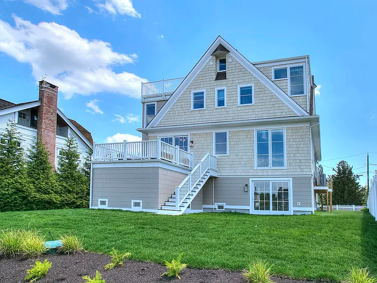 Spacious and beautifully landscaped rear yard overlooking marshlands