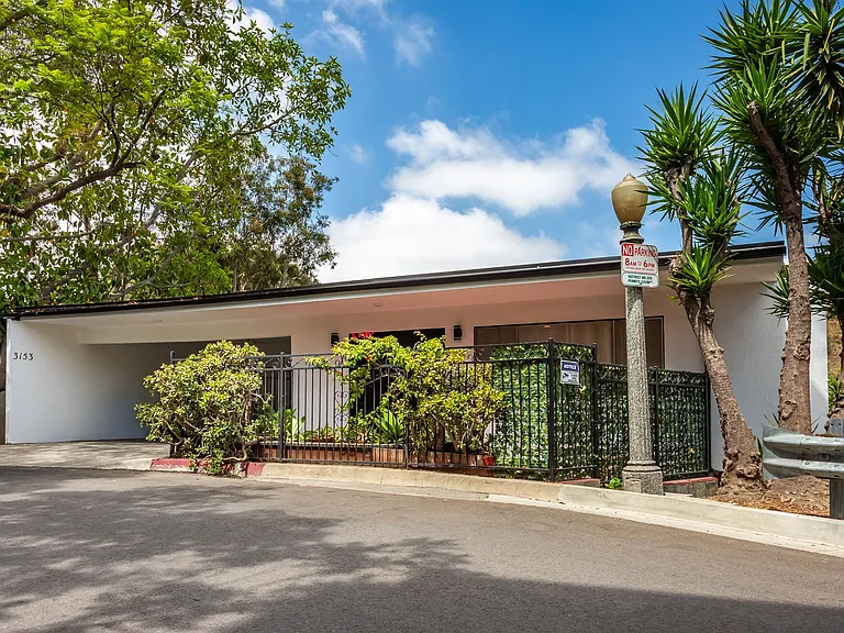 Mid-century 2-story custom home. . Over 1,800 sq. ft of custom living space. Must see to appreciate. Discreet entry on main level with carport, second floor is conveniently below