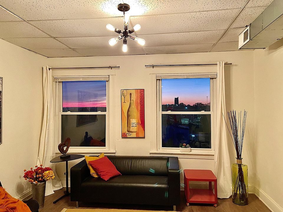 Living room with a view of sunset over Baltimore skyline