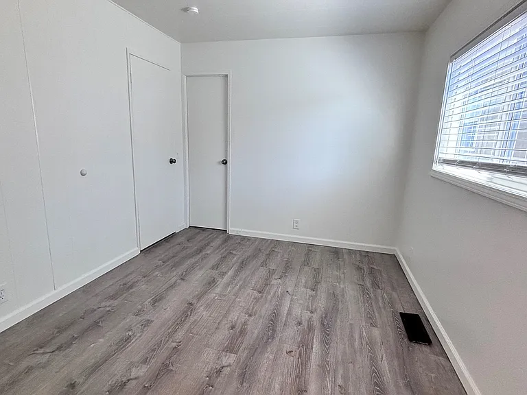 The primary bedroom serves as a private retreat, offering a spacious and comfortable setting to unwind at the end of the day.
