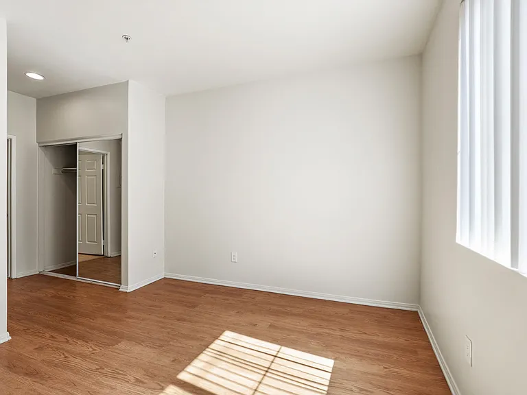 Bedroom with Closet and Window