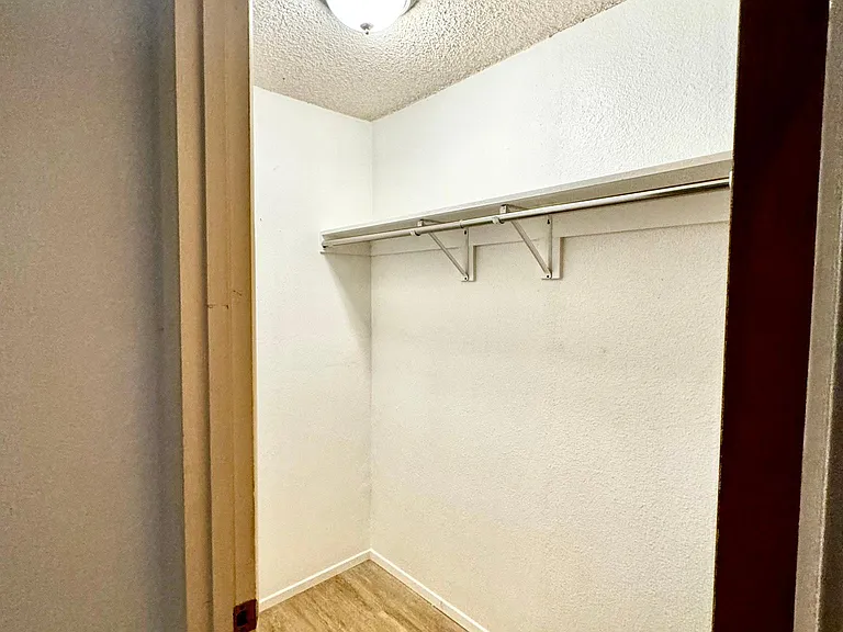 Walk in closet in guest bedroom no. 1