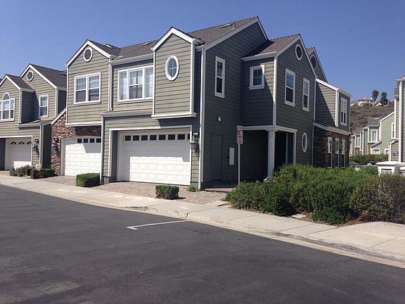 4746 Beachwood Court is a large end unit with a private entrance, views of the lagoon and a 2 car attached garage.