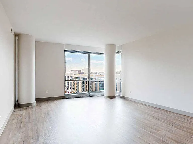 Expansive windows frame breathtaking views, bringing the vibrant energy of the city into your home.