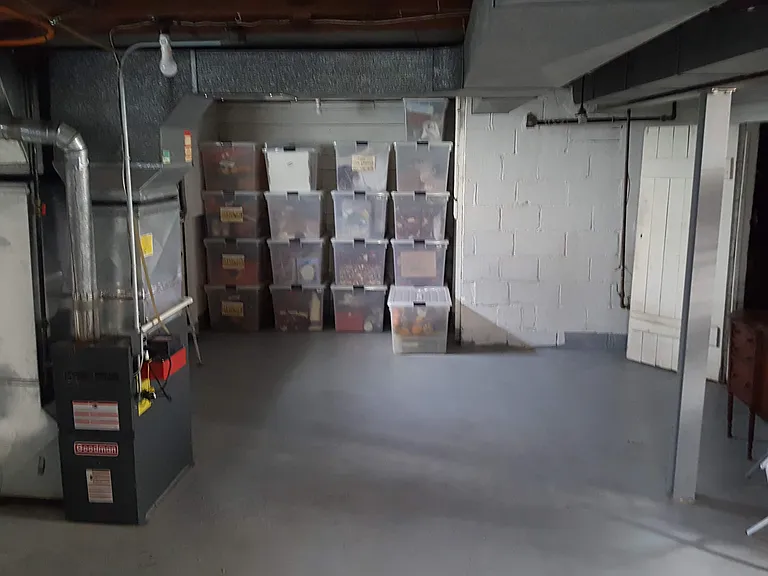 Basement. Workbench in the room through doorway