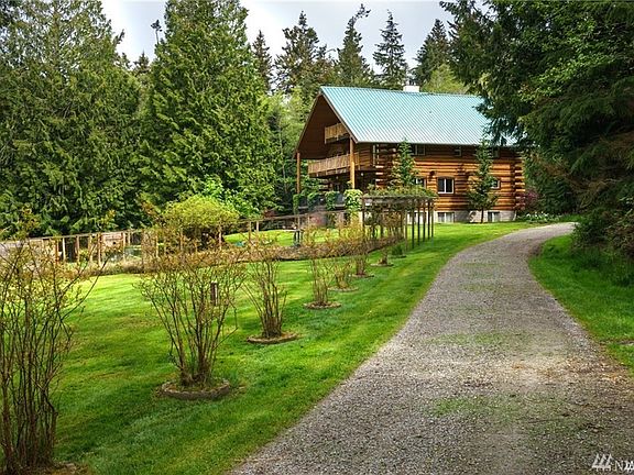 Enter this amazing property and drive down the circular drive around the home. Large garden area, blueberries, expansive lawn and nestled in a private setting yet close to town and amenities. 