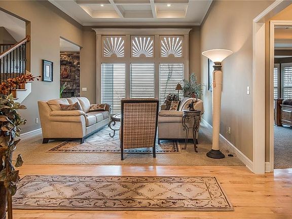 Step into elegance....notice the box beams in the ceiling.  Gorgeous plantation shutters.  Maple flooring.