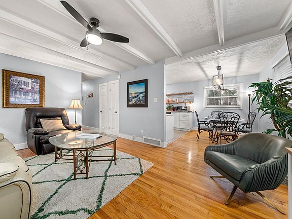 Living Room View Into Dining Room and Kitchen