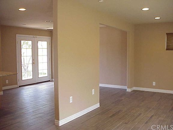 Looking From the Stairs - Large Living Room to the Right With Flow-Thru to Dining Room on the Left.