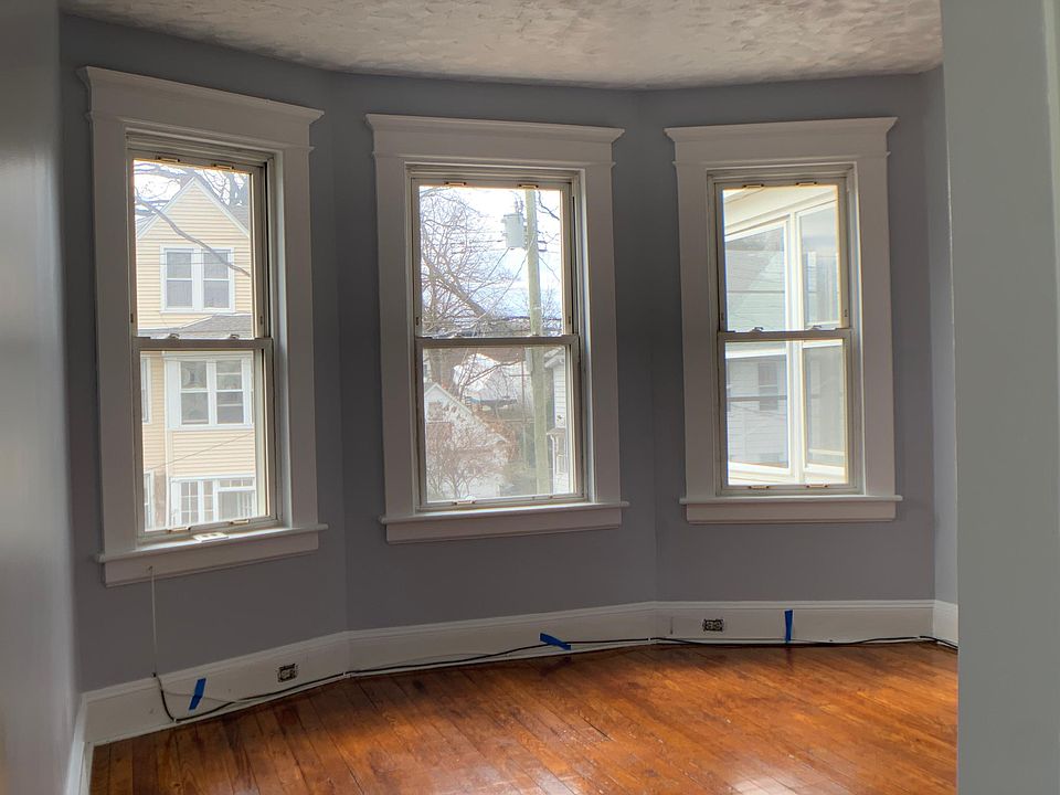 Living Room - Three large windows let in amazing natural light.