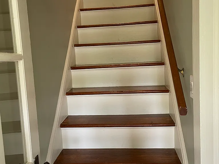 Stairs to go upstairs, that has 3 rooms, 1 bath