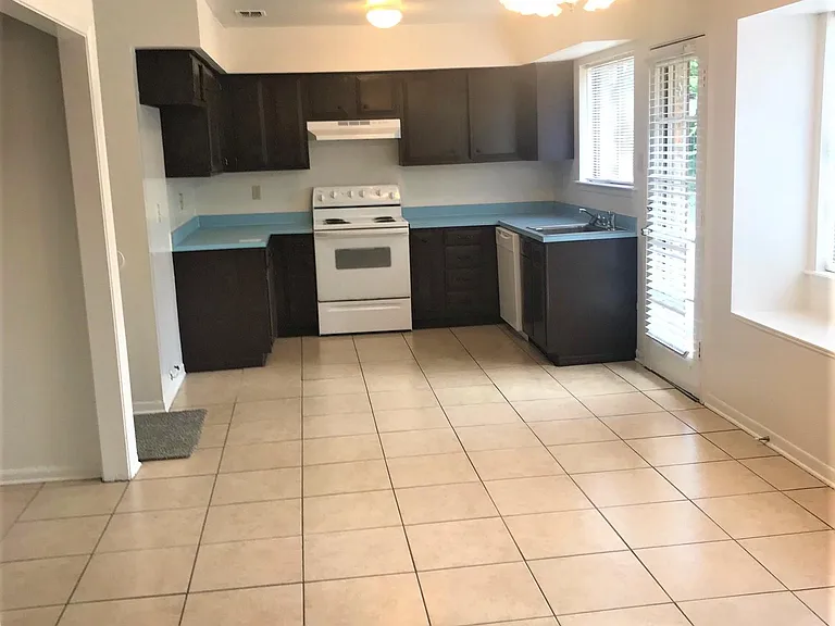 Kitchen, laundry room to the left as well as garage access