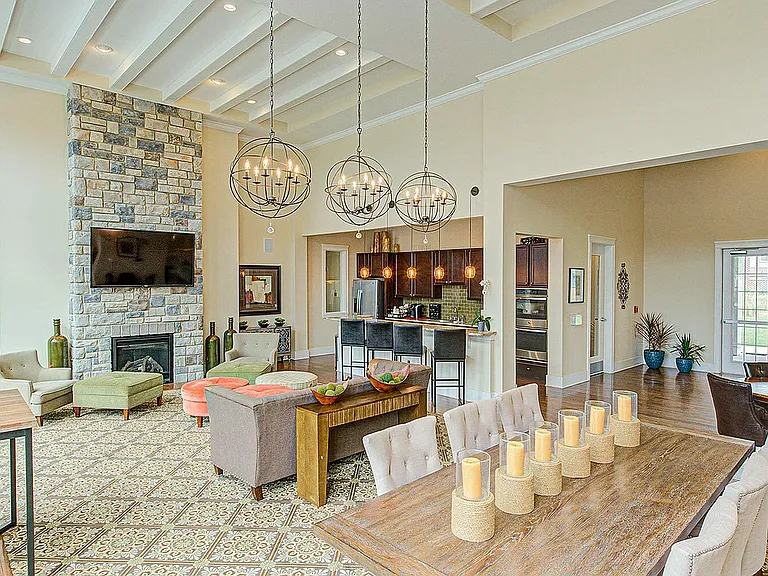 Kick back or catch up in our cozy resident lounge _ with a brick fireplace, TV, dining space, and community kitchen, it's your go-to hangout spot.