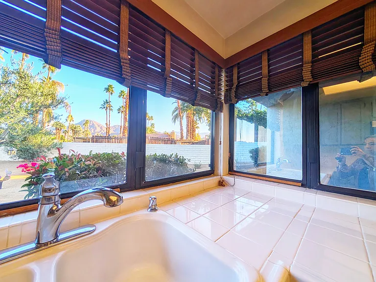 Picturesque views of manicured desert landscaping and mountain views.