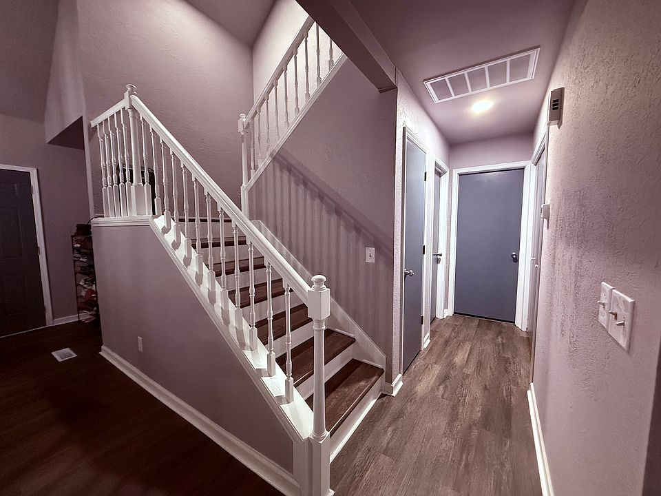 Hall way to bathroom downstairs and stairs to upstairs.