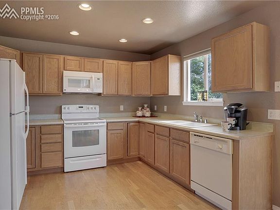 The kitchen offers plenty of cabinet and counter space!