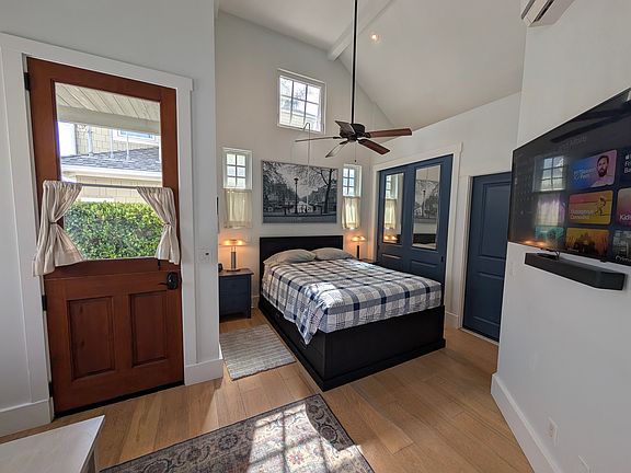Queen Size bed with storage drawers and large closet with extra storage loft.