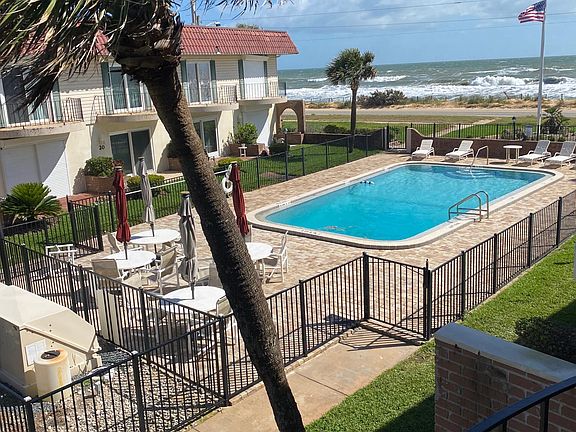 view of pool from second floor balcony