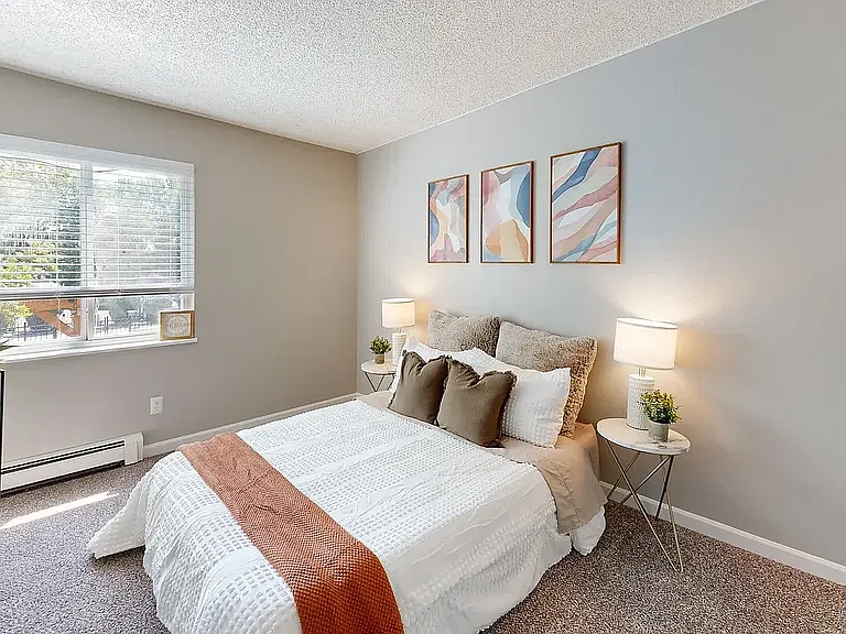 Comfortable and stylish bedroom with soft lighting and modern finishes at Glen Ridge Apartments.