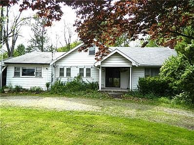 1930 1.5 story bungalow sits on 1 acre of pure seclusion! 2,196 sq. ft., 4 BRs (really 5!), 2 full baths, LR and huge FR w/wood burning fireplace, and great workshop attached to 2 car garage. Needs TLC, but move-in ready!