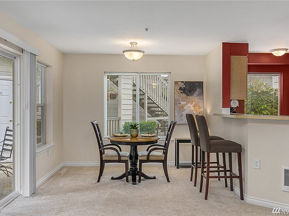 Dining room space adjacent to the kitchen with direct patio access.