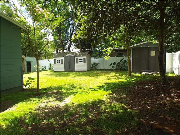 Fenced Backyard with Sheds