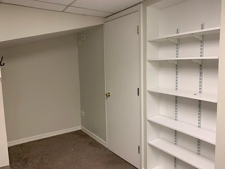 Separate side cove for office space and book shelves built in