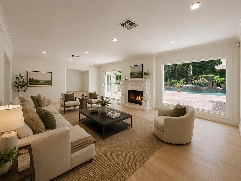 Bright living room with cozy fireplace and pool views defines this Beverly Hills luxury rental home, offering elegant Los Angeles luxury living at 1094 Garden Lane for a 90210 lease.