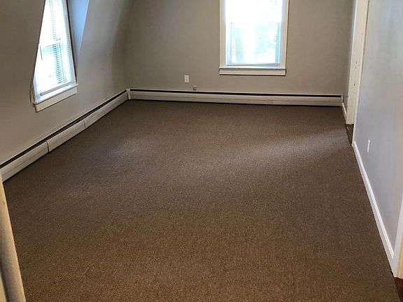 The main living space, empty before flooring was redone.