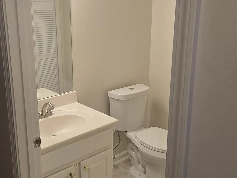 Hallway half bathroom and laundry room