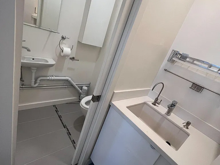 Kitchenette with built in refrigerator and Microwave