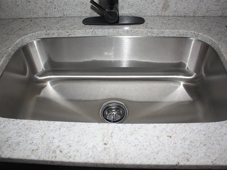 stainless sink, bronze faucet