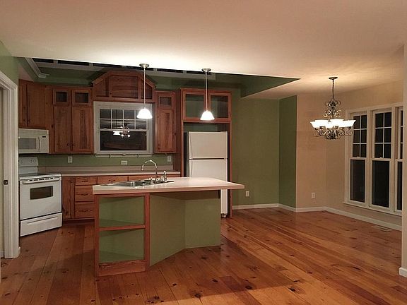 Kitchen with dining room and bar area