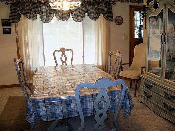 dining room has a huge window and is open to kitchen and living area